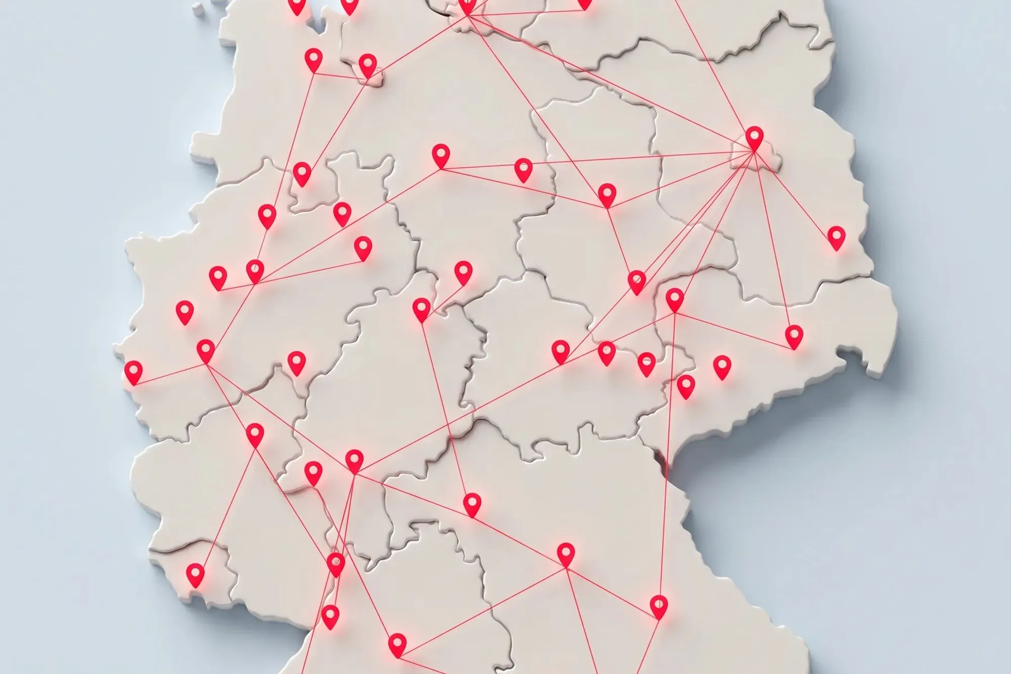 3D-Karte Deutschlands in Weiß mit roten Standort-Pins, die durch dünne rote Linien verbunden sind, auf hellem Hintergrund.