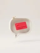 3D white speech bubble with a red message card and gold sparkles on beige.