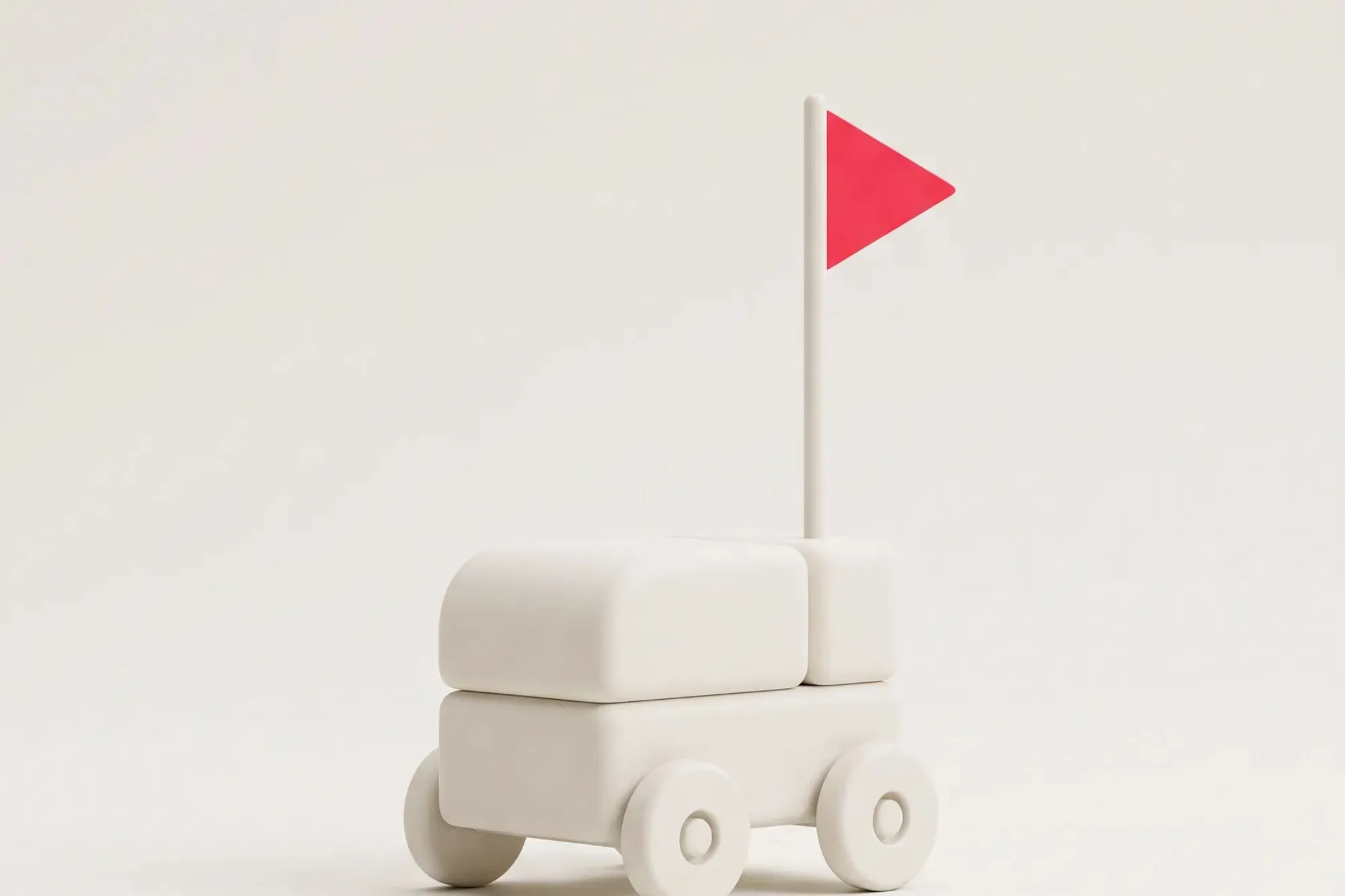 Minimalistischer weißer Spielzeugwagen auf Rädern mit einer kleinen roten dreieckigen Flagge